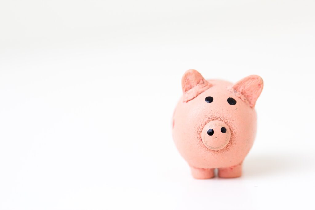 A pink piggy bank on a white background.